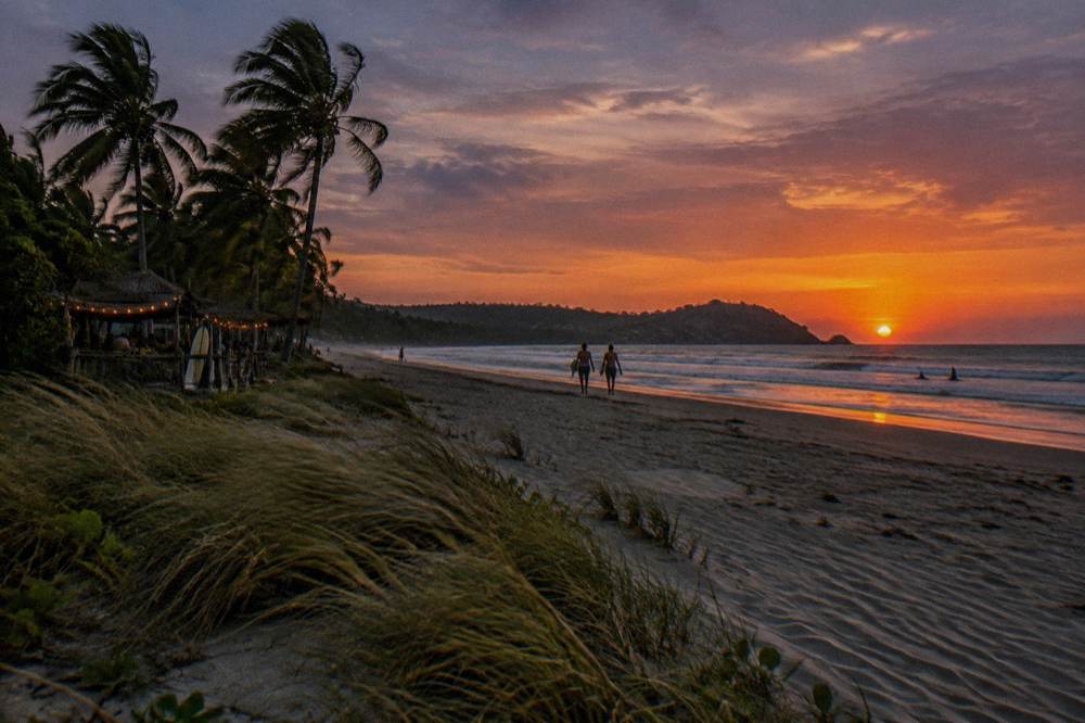 Dramatic sunset sky over the Pacific horizon seen from the Tamarindo shoreline
