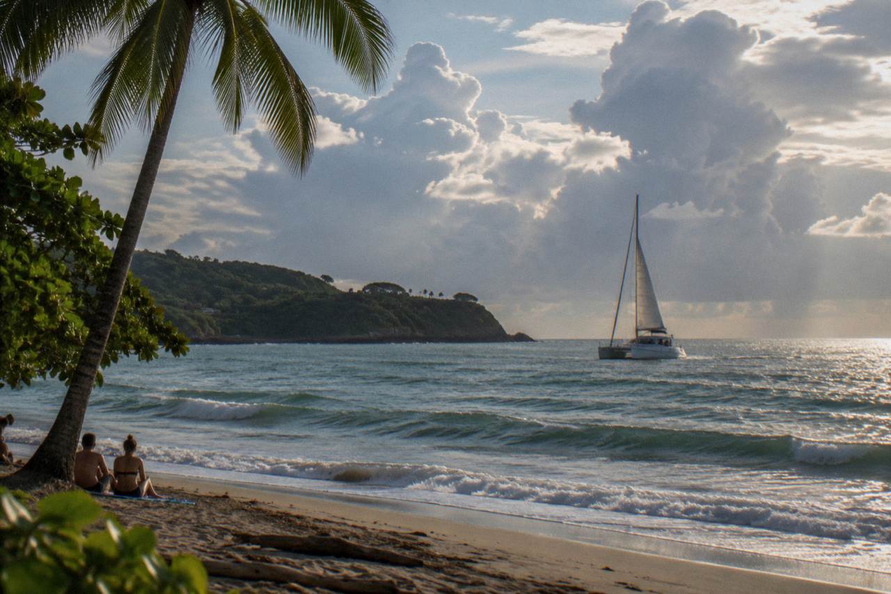 Catamaran under a partly cloudy sky off the Guanacaste coast near Tamarindo